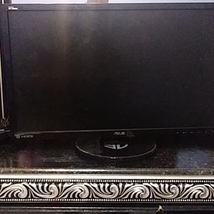 A monitor with half keyboard and hdmi cable